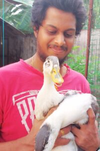 Pramodh Jayalath holding ducks